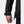 Black Men's Crew Hooded Midlayer Jacket 2.0 by Helly Hansen, with a hand pulling the drawstring hem, a folded cuff, and a visible side zipper pull.