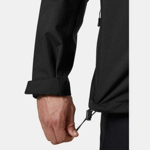 Black Men's Crew Hooded Midlayer Jacket 2.0 by Helly Hansen, with a hand pulling the drawstring hem, a folded cuff, and a visible side zipper pull.