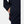 Dark blue men's midlayer jacket by Helly Hansen, side view, showing a hand in its zippered pocket with a red pull and an adjustable cuff.