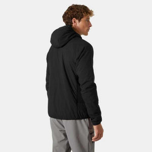 Black hooded insulator jacket from Helly Hansen, shown from the back-right side on a man wearing grey pants.