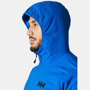 Blue hooded insulator jacket by Helly Hansen, on a man in side profile, featuring a black HH logo.