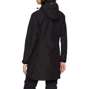 Black Women's Long Belfast Jacket by Helly Hansen, shown from the back, featuring a hood with an HH logo, worn over dark pants.