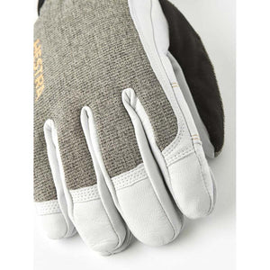 Light gray leather and gray fabric short gloves by Hestra, with textured panels and reinforced finger pads.