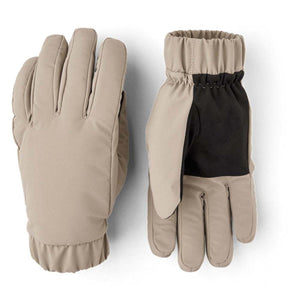 Beige warming gloves by Hestra with black palm accents and elasticized cuffs.