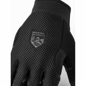 Black mesh 5-finger gloves by Hestra, featuring an embossed logo patch with "1936" on the back and white stitching.