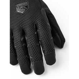 Black gloves by Hestra featuring a mesh back, visible stitching on the fingers, and a Hestra 1986 logo.