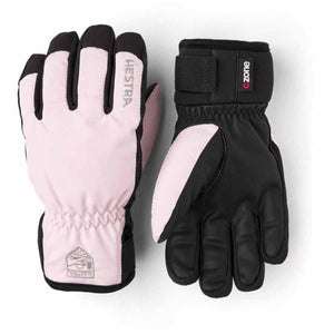 Pink and black insulated gloves by Hestra, showing a back view and a palm view, with visible logos.