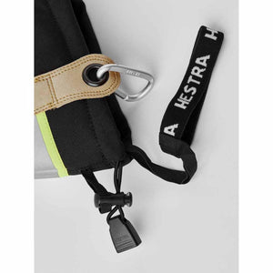 Black GoreTex Pro 5-Finger Gloves by Hestra, cropped, with a lime stripe, tan wrist strap, silver carabiner, and black lanyard showing brand text.