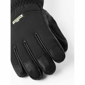Black 5-finger glove by Hestra, with textured fabric and leather fingertips, and a Hestra Pro label.