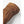 Brown nubuck leather gloves by Hestra, featuring prominent white zigzag stitching, a debossed Hestra logo, and an elasticized cuff in a cropped view.