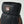Textured black leather 3-finger glove by Hestra, featuring brown accents, a Hestra logo patch, and an adjustable wrist strap.