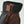 Brown and black leather 3-finger glove by Hestra with an adjustable wrist strap and black fabric cuff.