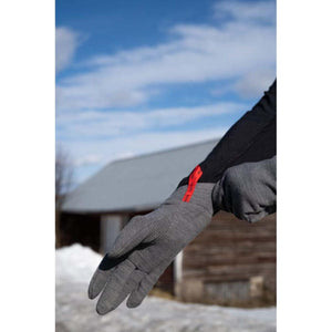 Grey 5-finger thin inner gloves by Hestra, with a dotted grip on the palm and a red wrist tag.