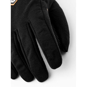 Black Merino Windwool 5-finger gloves by Hestra, with textured fabric, diamond grip on the palm, and an orange-bordered patch.
