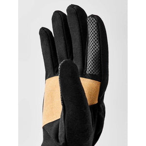 Black and tan unisex merino windwool liner 5-finger gloves by Hestra, featuring a tan accent band and textured grip on the index finger.