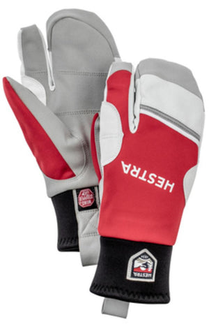 Red, grey, and white 3-finger ski gloves by Hestra, featuring black cuffs and striped accents.