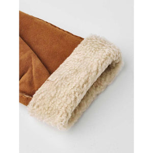 Brown suede leather gloves by Hestra, with a thick, folded light beige shearling cuff.