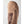 Tan fluffy and dark brown leather mittens by Hestra, with quilted detail on the palm and thumb, side view.