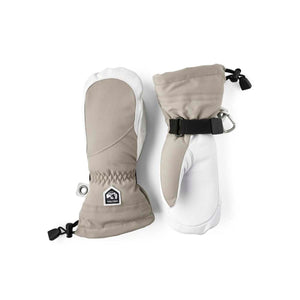 Light brown fabric and white leather women's mittens by Hestra, with drawstring cuffs and a carabiner clip.