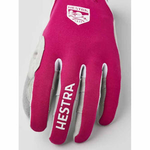 Fuchsia and grey ski glove by Hestra, featuring white Hestra branding with '1936' on the back and 'HESTRA' text on the middle finger.
