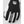 Close-up of a black and white ski glove by Hestra, featuring the brand logo on the back and 'HESTRA' text on the middle finger.