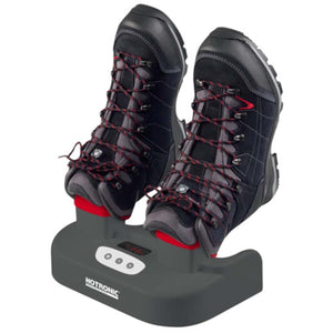 Gray and red boot, helmet, and glove dryer by Hotronic, holding a pair of black and gray hiking boots with red laces.