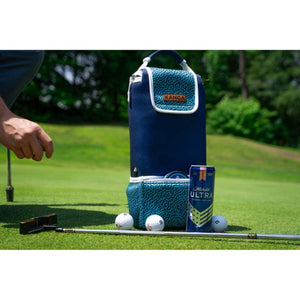 Navy blue and teal patterned neoprene Cooler Hideaway by Kanga Coolers, with golf balls and beer can on a golf course.