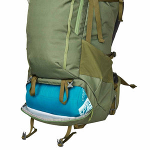 Asher 65L backpack by Kelty, olive green, with a blue sleeping bag in the open bottom compartment.