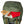 Dark green 65L backpack by Kelty, top opening reveals a 'FIELD NOTES' notebook, map, orange flashlight, and red knit hat.