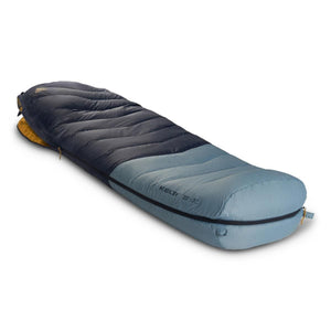 Puffy two-tone blue sleeping bag by Kelty, with dark blue and light blue sections, a visible zipper, and '20F/-7C' rating.