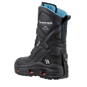 Black insulated winter boots by Korkers with a blue collar, orange sole accents, rugged sole, and a heel strap, in side view.