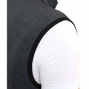 Dark grey men's heat vest by Lenz with subtle quilting and black armhole trim, over a white t-shirt, side view.