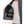 Dark grey heat vest by Lenz, open to show inner pockets with a battery pack, worn over a white t-shirt.