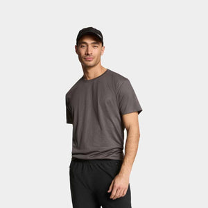 Black performance baseball cap by Mission, featuring white text on front, worn by a man.