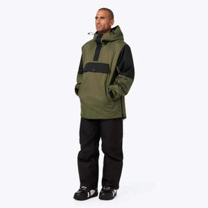 Olive green and black Men's anorak 1/4 zip heated hoodie by Mobile Warming, with a front pouch pocket, worn by a man with black pants.