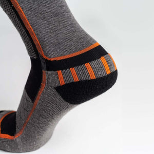 Grey Men's Premium Merino Heated Socks by Mobile Warming, with black and orange striped accents and an orange side seam.