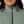 Sage green Women's Aria Hybrid Heated Jacket by Mobile Warming, showing a high collar and diamond quilting, zipped fully.
