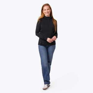 Black 1/4 zip long sleeve mock neck shirt by Mobile Warming, with a ribbed texture, worn by a woman with blue jeans and sneakers.