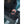 Black women's heated glove liner by Mobile Warming, worn by a person, with an illuminated orange wrist button and connected power pack.