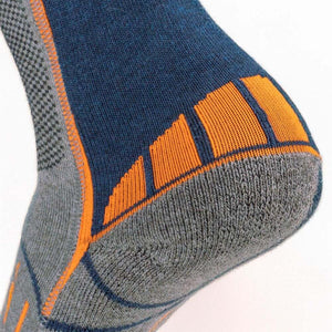 Blue, grey, and orange wool blend heated socks by Mobile Warming, with textured grey panels, ribbed heel, and orange accent stripes, close-up side view.
