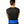 Blue segmented herbal pack by Nature Creation, worn on the lower back of a person in a black shirt, seen from behind.