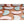 Assorted Gal Pals Chill Set by Opal Cool in light pink, blue, and white cushioned pads, scattered on brown.