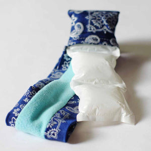 White Ultimo Coolpaks by Oro Sports, two pouches nestled in a blue paisley sleeve with light blue fleece.