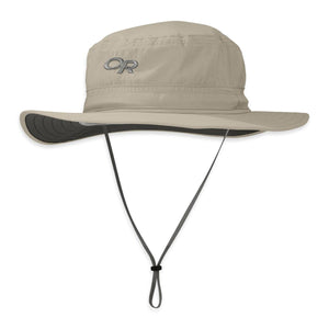 Beige fabric Helios Sun Hat by Outdoor Research, featuring an 'OR' logo, wide brim, and adjustable chin strap.