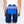 Blue U-shaped cold therapy pad and purple elastic belt by Polar Products, with a rigid blue component, worn on a person's lower back.
