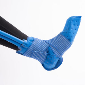 Blue foot and ankle cold therapy wrap by Polar Products with white-striped elastic straps and perforated material, connected to blue tubes on a leg.