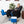 Large blue textured foot and ankle cold therapy pad by Polar Products, connected to a white and blue cooler, worn on a foot in a black recliner.