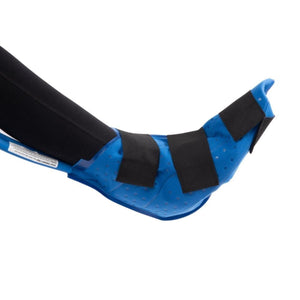 Blue large foot and ankle cold therapy pad by Polar Products, secured with black straps to a leg wearing black leggings.