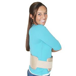 Beige torso wrap by Polar Products worn on a woman's lower back over a blue long-sleeve shirt.