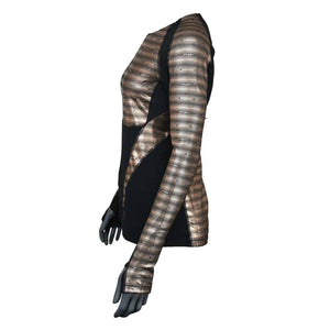 Women's long sleeve 1/4 zip base layer top in black and metallic striped bronze by Seirus, with diagonal panels on a mannequin side view.